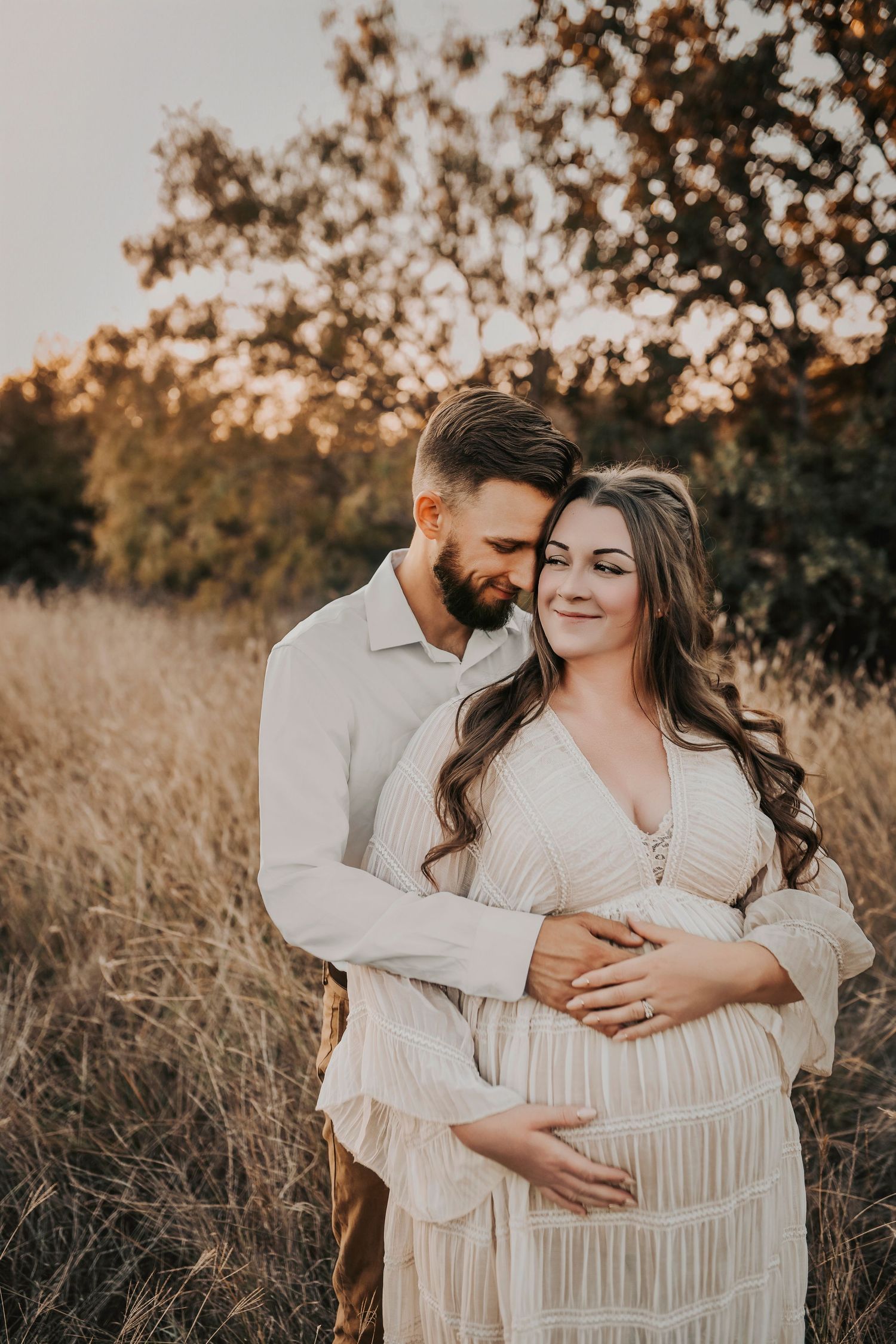 Family maternity photos celebrating the transition from a family of four to a family of five