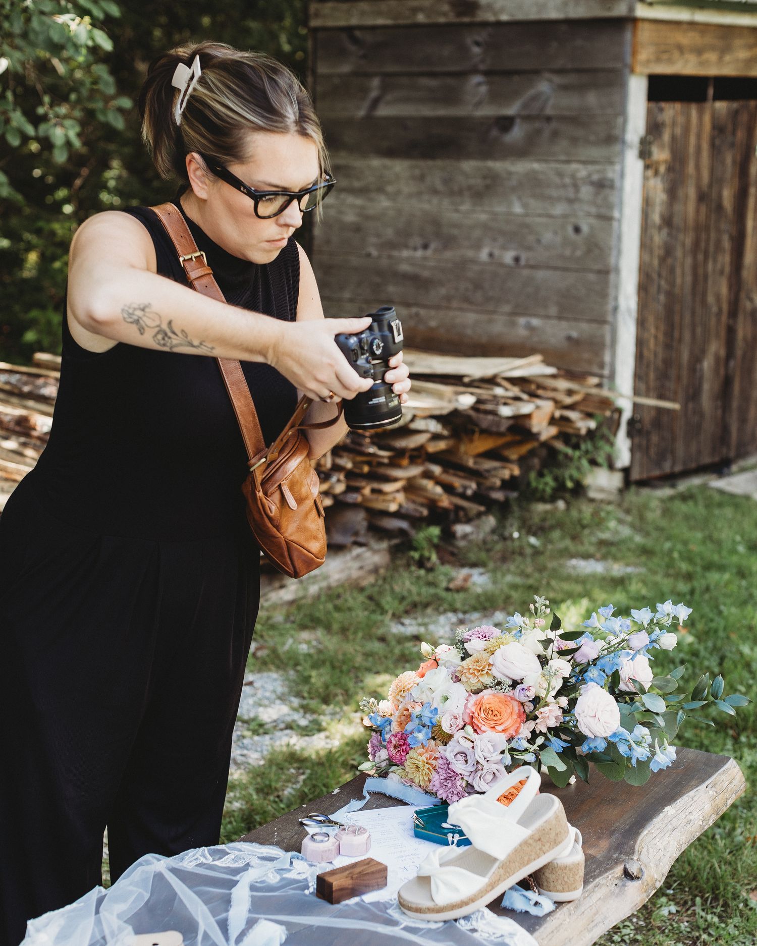 Maine wedding photographer Chelsea Gallagher photographing a bride and groom during their wedding day.