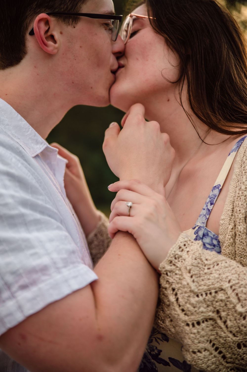 Engaged couple sharing a kiss during their outdoor engagement session in West Central Ohio