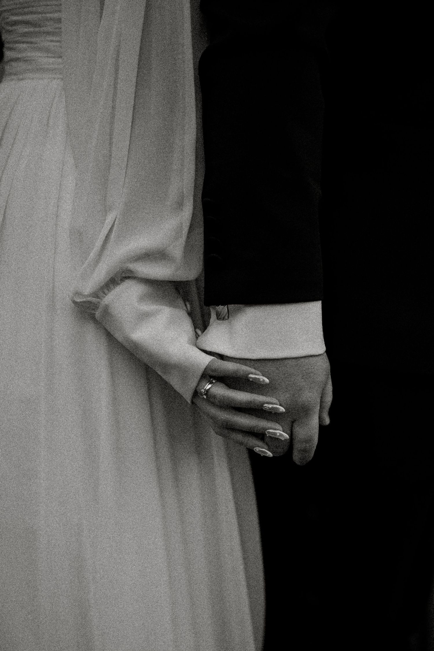 Artistic black and white detail of white fabric against dark background.