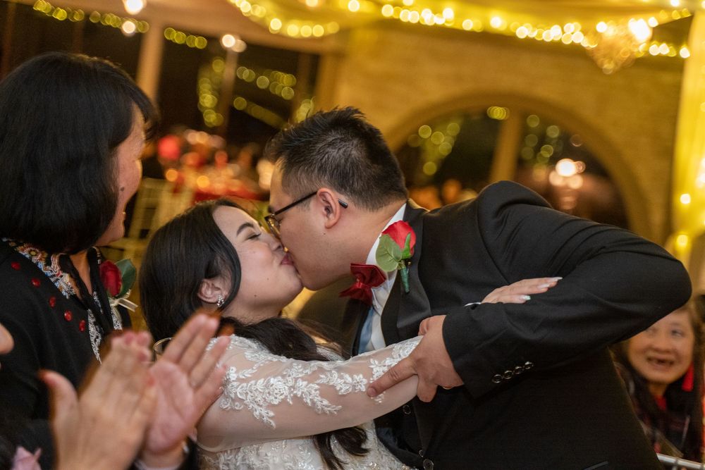Dramatic dip kiss portrait of bride and groom at The Buttes at Reflections in Tucson, Arizona, photographed by N&D Media Production.