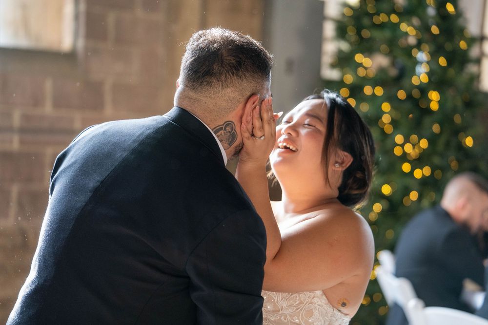 Bride smiling as groom dips her during their first dance at The Hitching Post in Utah, by N&D Media Production.