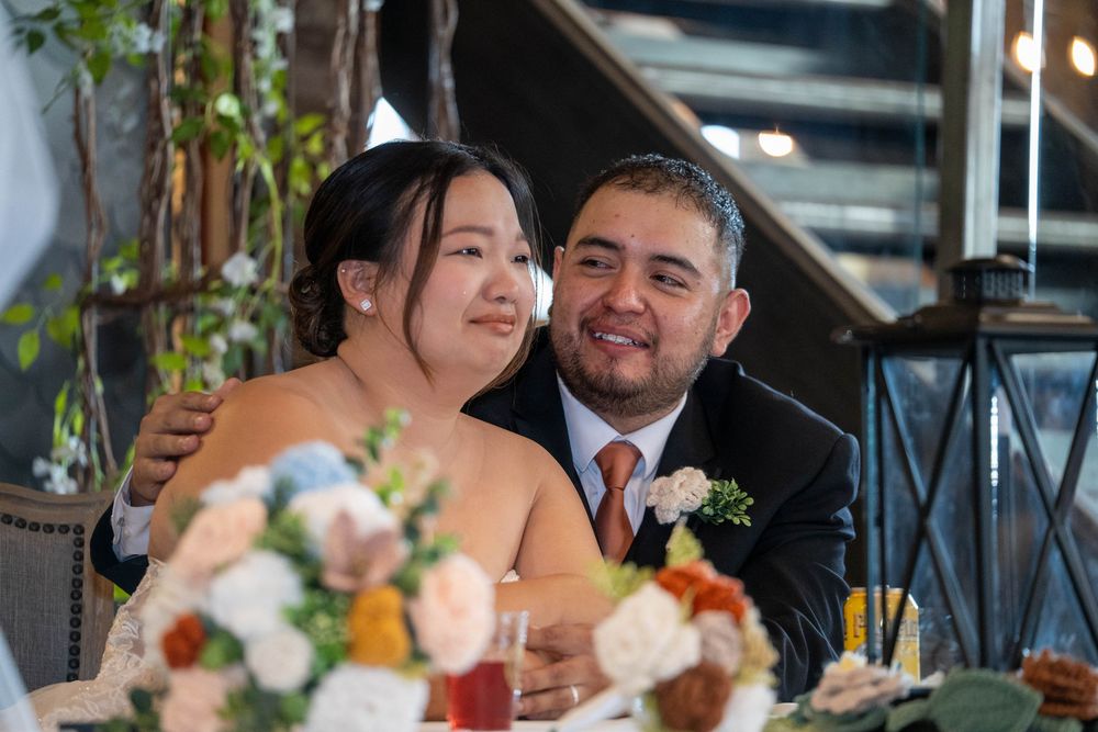 Emotional moment as groom holds bride during reception speeches at The Hitching Post in Utah, captured by N&D Media Production.