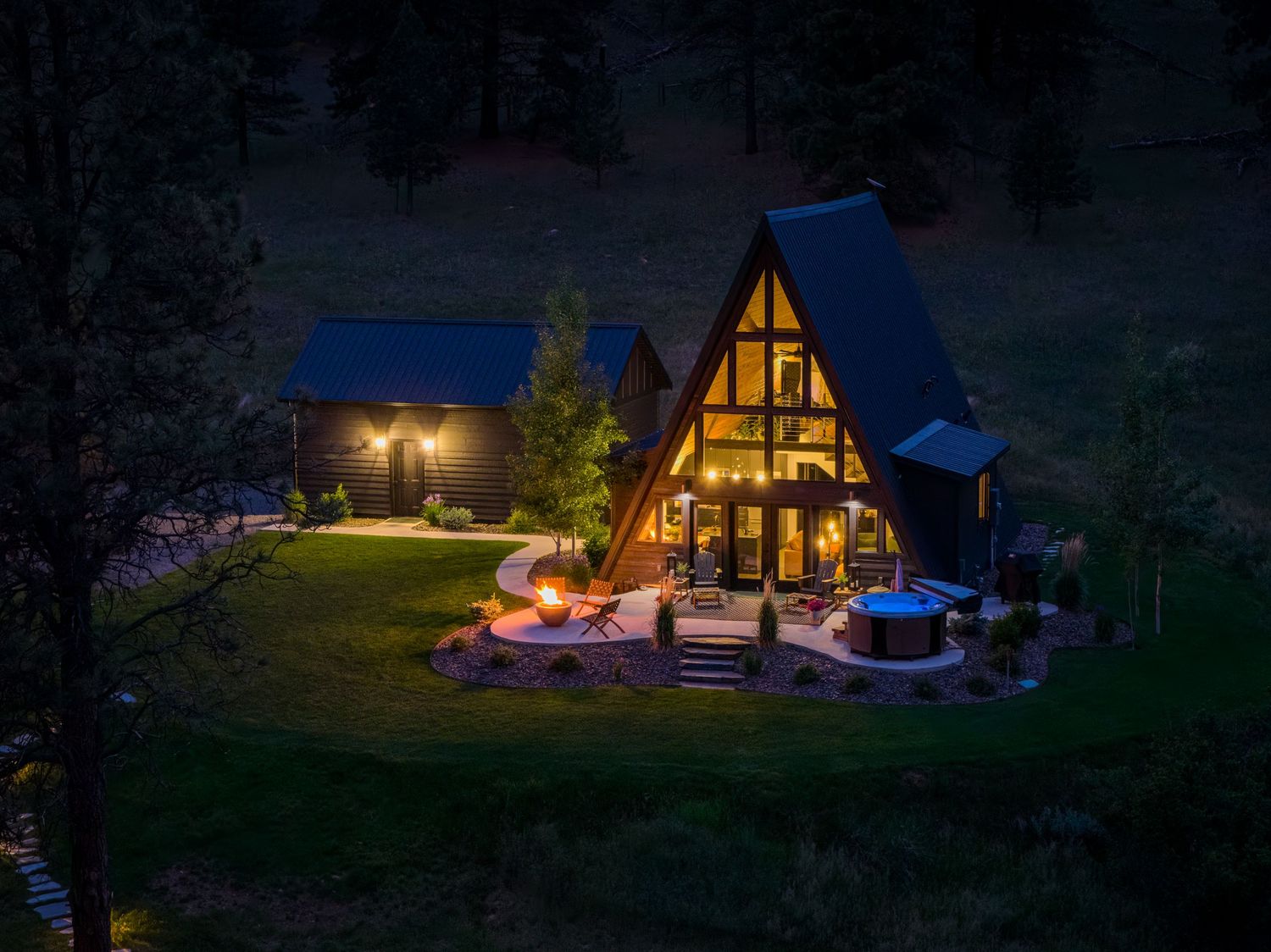 Aerial/drone night shot of vacation rental property, Little Black Aframe in Helena, MT.