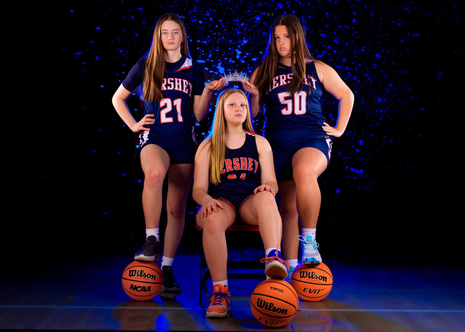 Three Hershey girls basketball players media day portrait, dramatic blue lighting, by Deanna Fox, SportsFox Photography based in Hershey PA