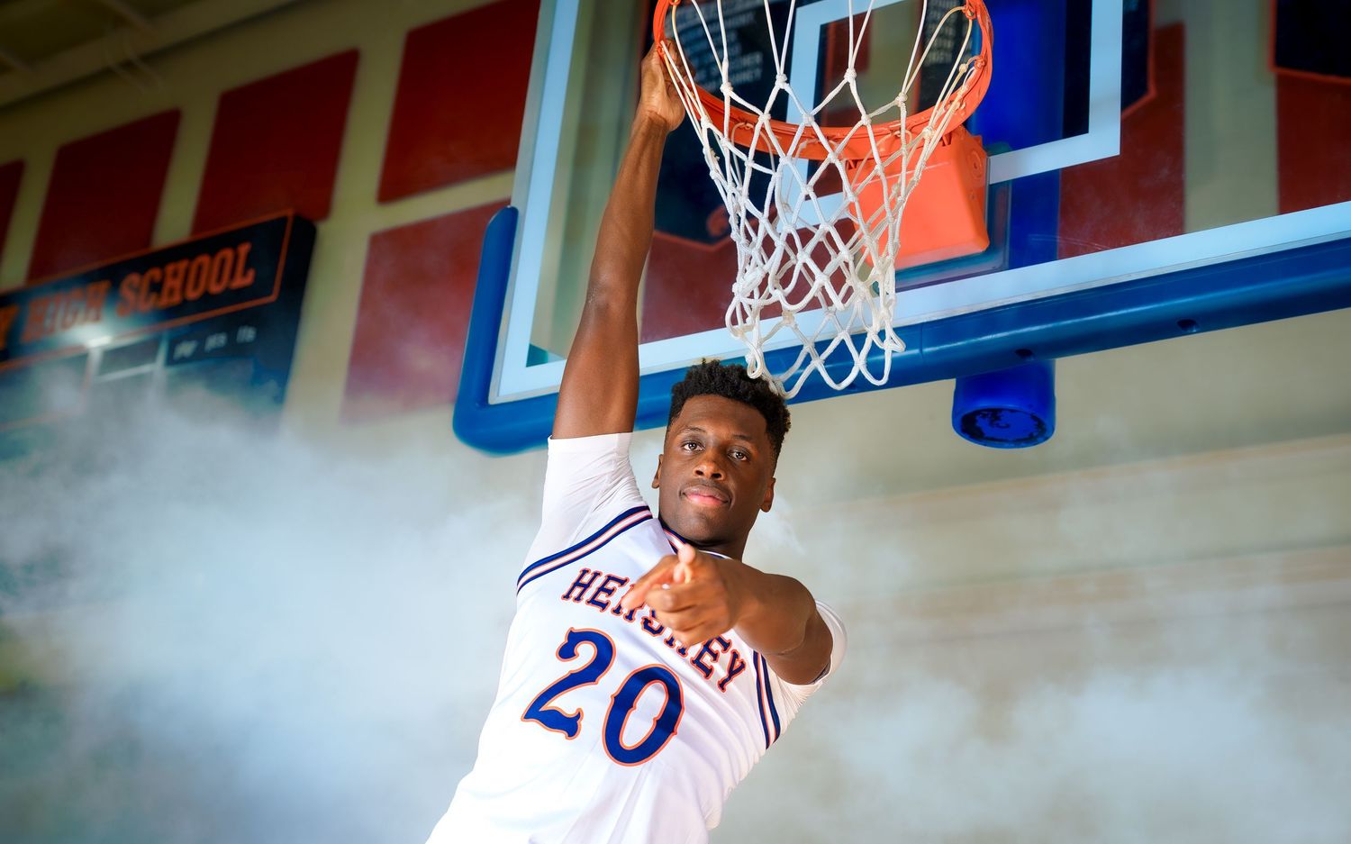 Hershey basketball player #20 dunking with dramatic fog, media day portrait, by Deanna Fox, SportsFox Photography based in Hershey PA