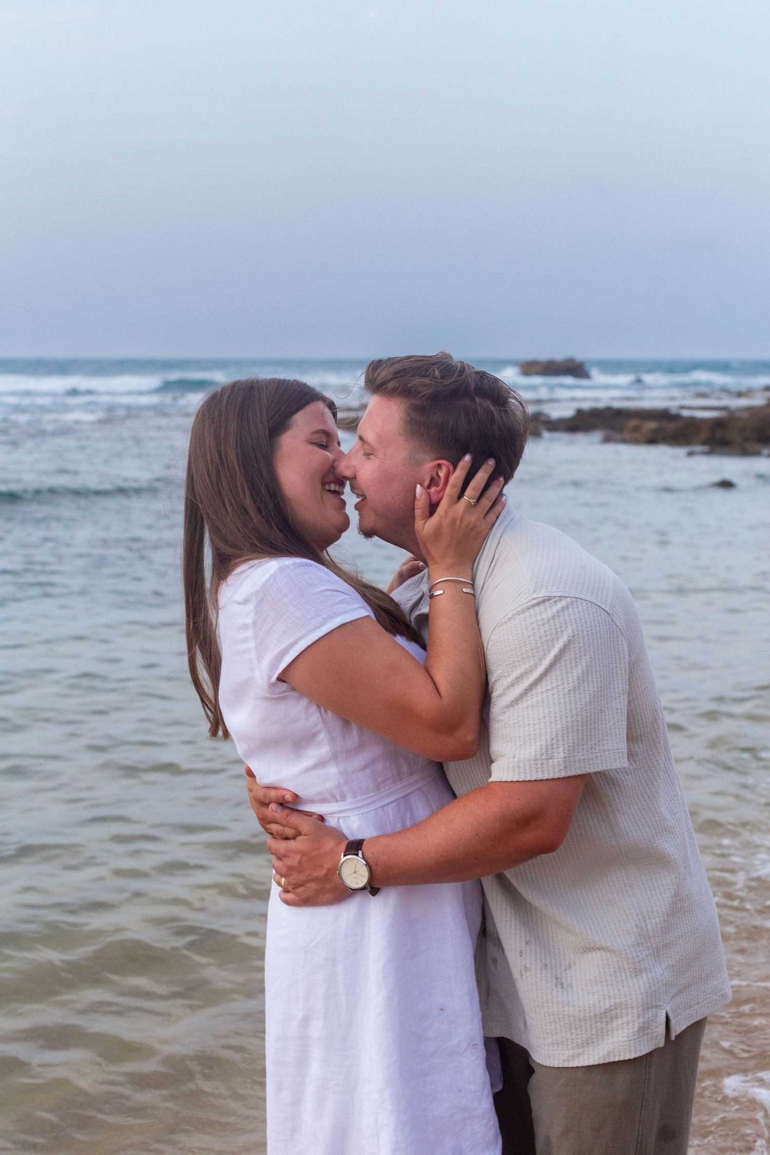 Couples portrait on the beach at Balneario del Escambrón in Old San Juan, Puerto Rico.