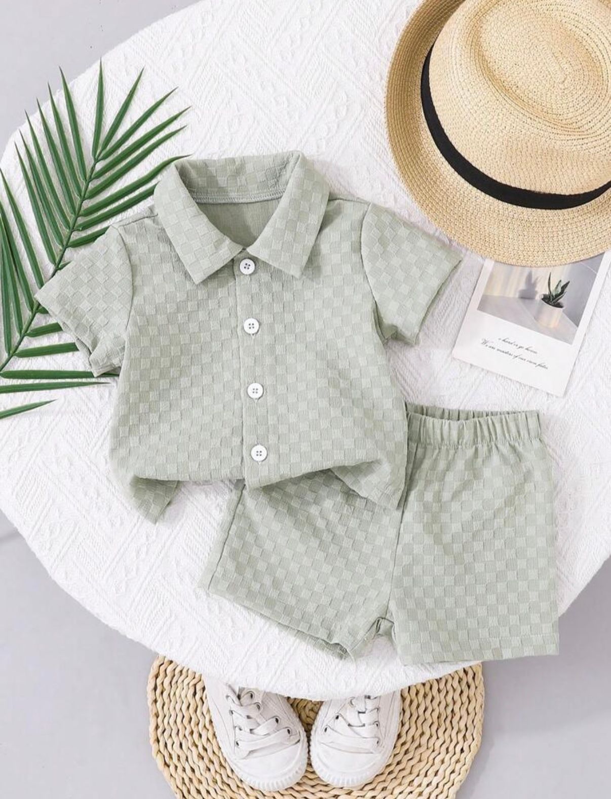Baby boy's sage green patterned shirt and shorts set with matching accessories.