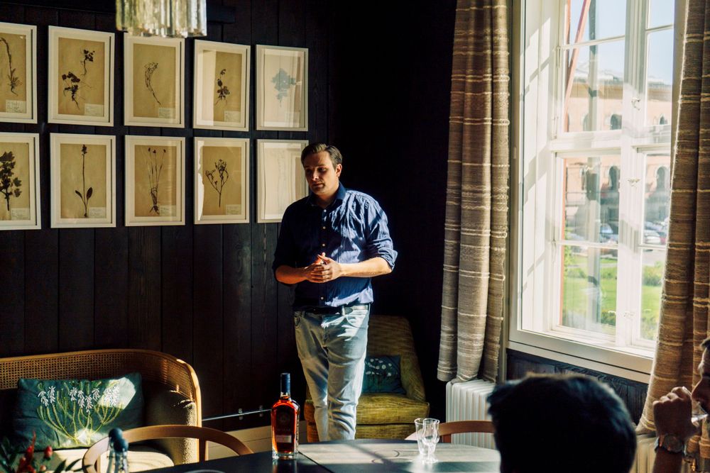 A man giving a presentation in a smoky room