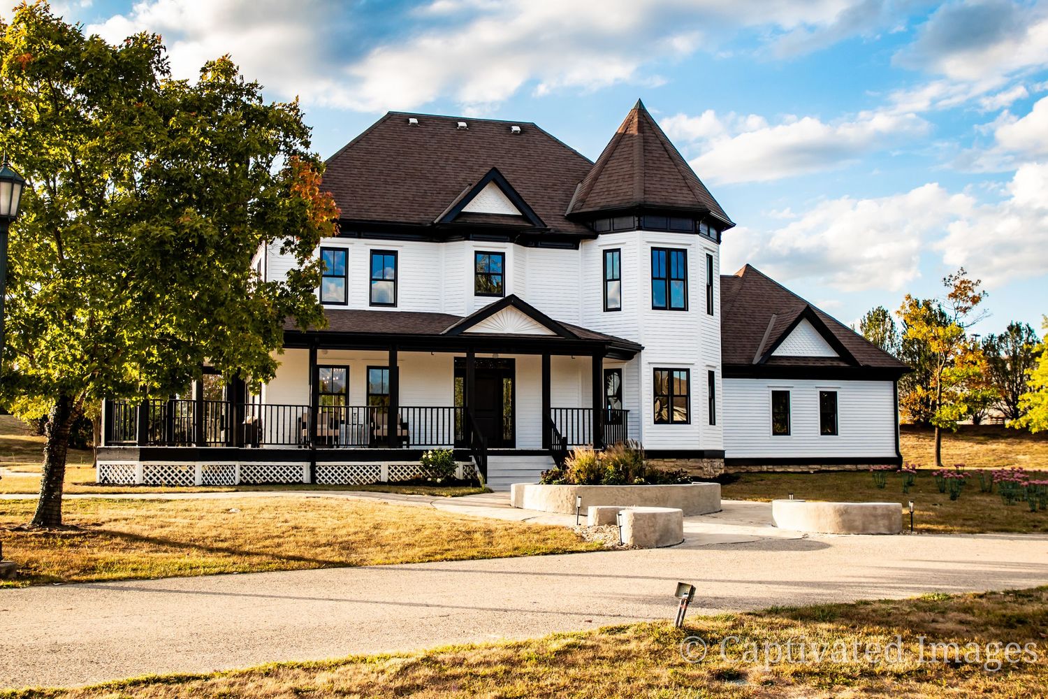 Modern farmhouse style home with white exterior and black trim shown from multiple angles in a rural setting.