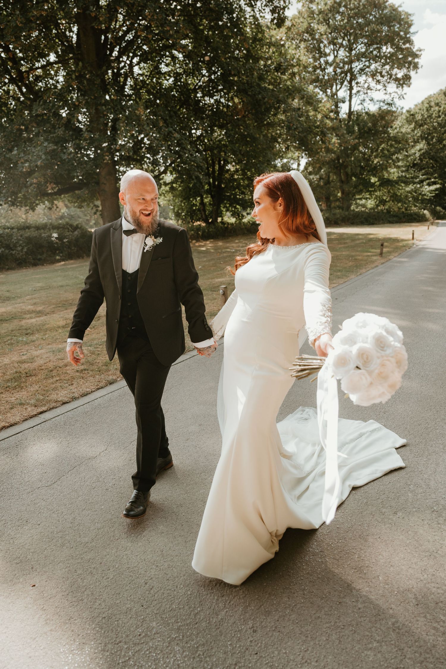 Ethereal bridal portraits in moody lighting showing flowing white wedding dress and delicate veil details.