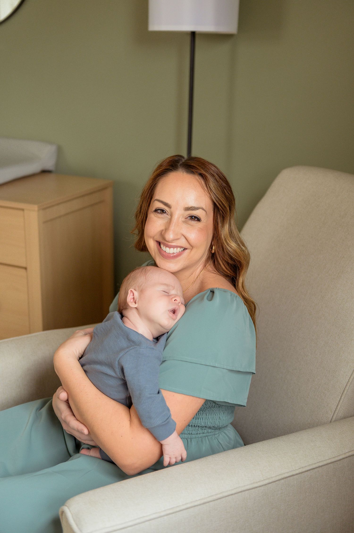 A tender family moment shows a parent and child sharing affection and laughter against a neutral background.