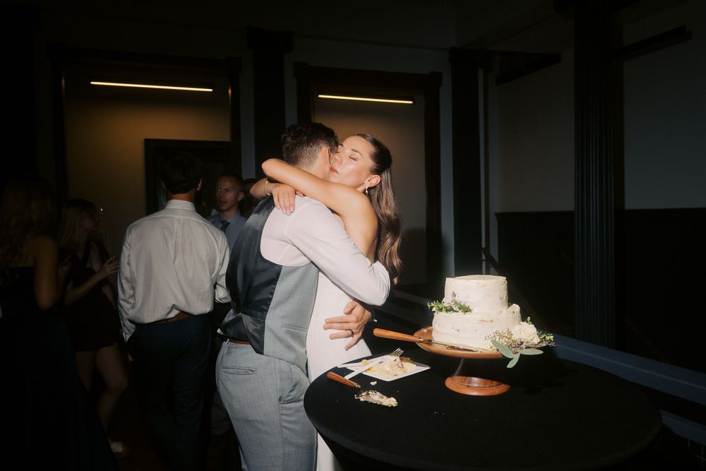 A series of dark, candid reception photos showing couples dancing and celebrating at a wedding event.