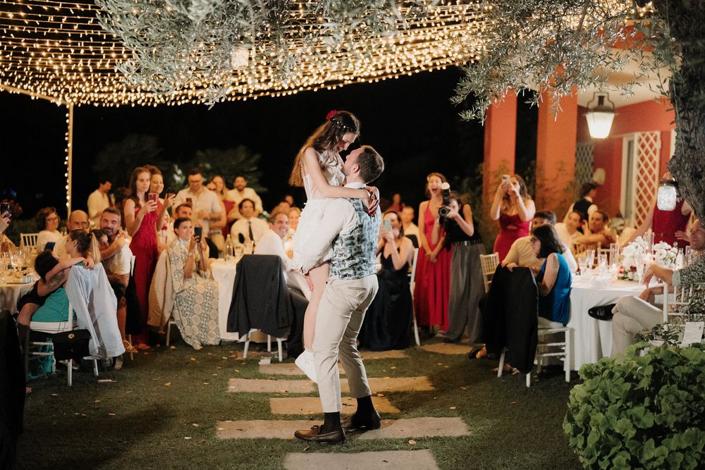Bride and groom dancing and having fun during the evening wedding party at Villa Casa Rossa in Imperia.