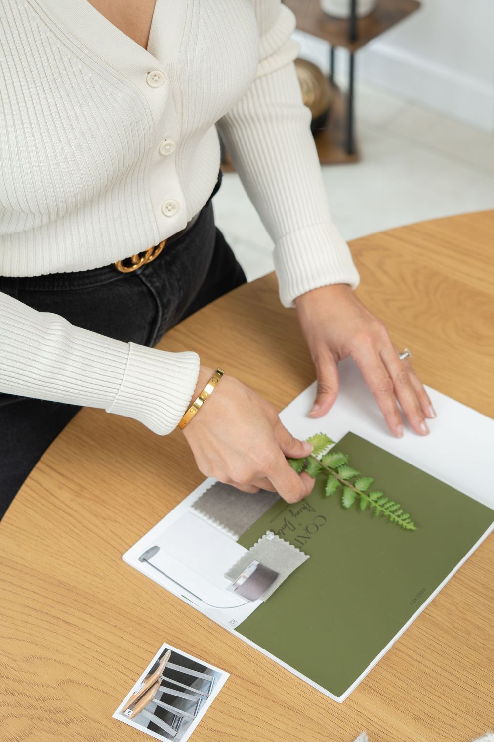 Home stager and interior designer working with an interiors mood board