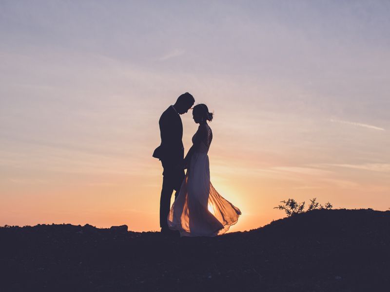 Couple silhouette at sunset in Santorini