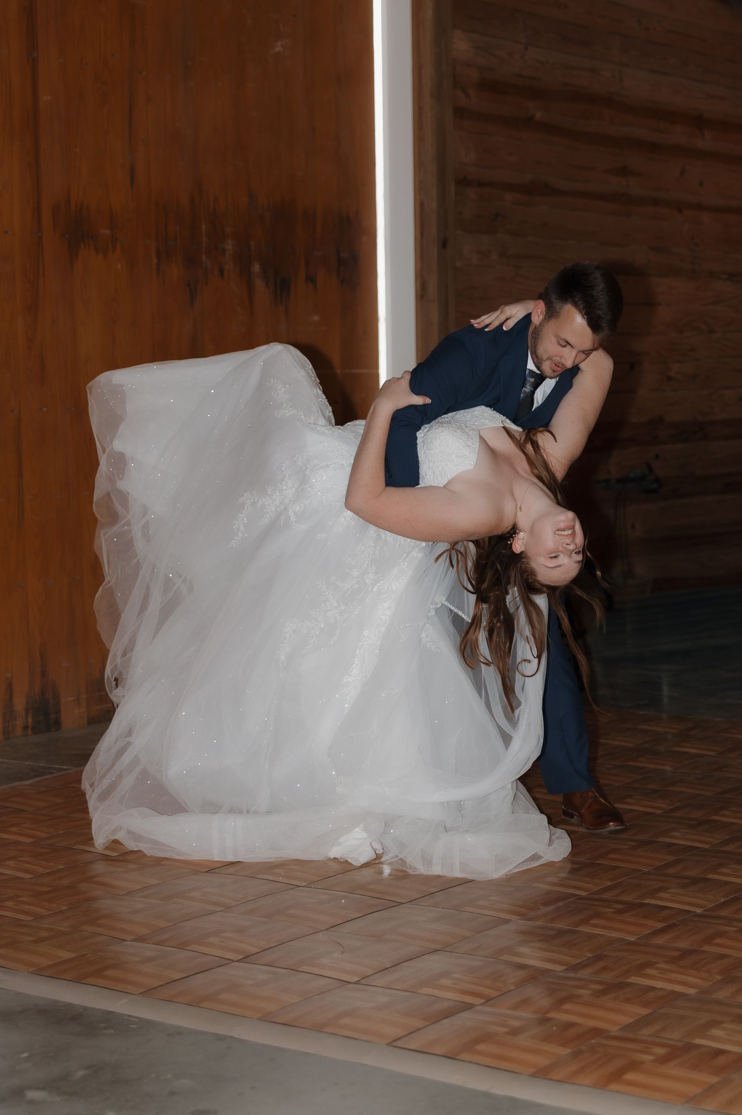 A romantic wedding dance dip sequence showing the progression of movement across four connected photos.