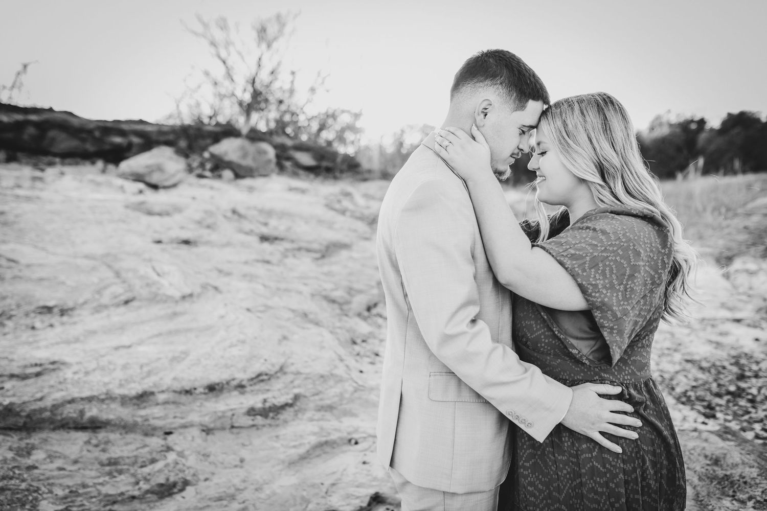 Engagement session with rust colored dress in Flower Mound field.