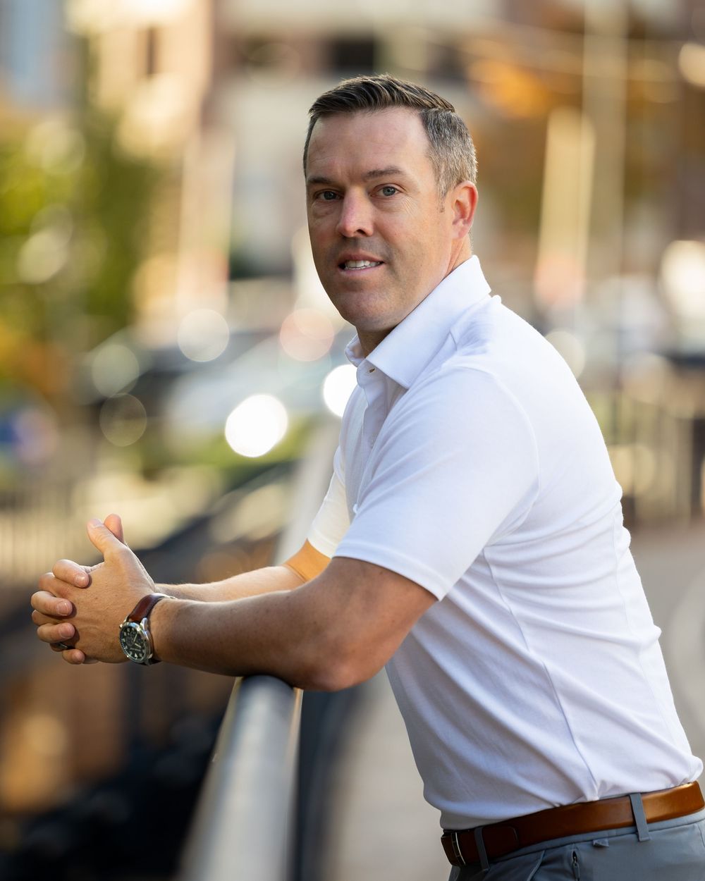 A sequence of images showing someone in a white shirt demonstrating a golf swing motion from different angles.