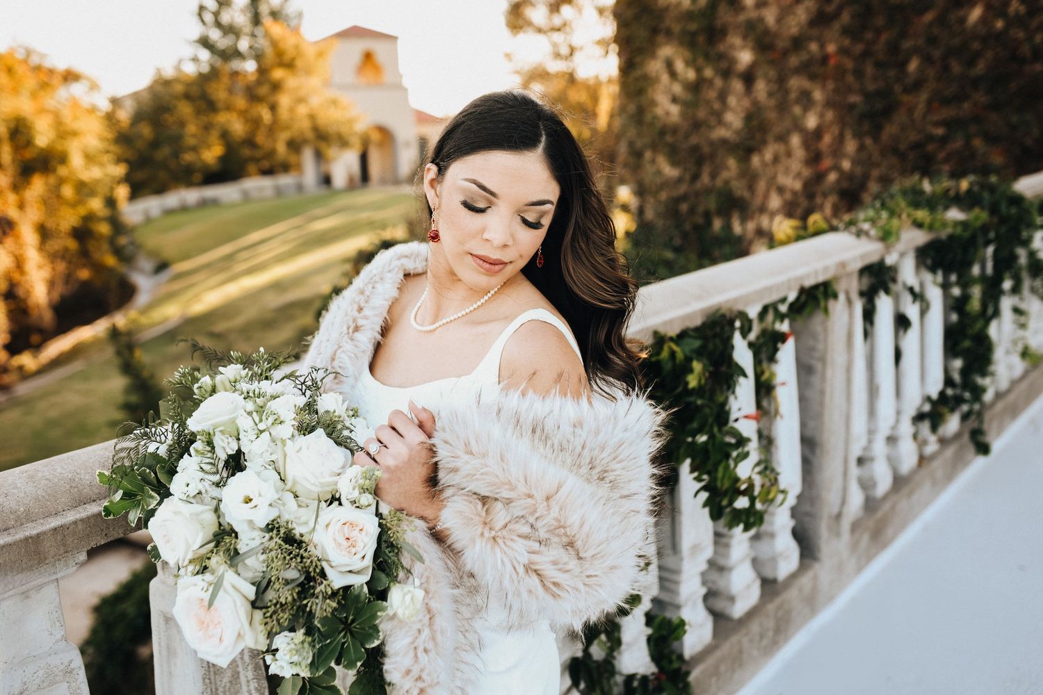 Soft organic bridal portrait with textured stone and greenery at Stoney Ridge Villa