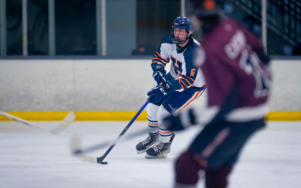 Hershey High School hockey player skating with the puck at Flyers Cup quarterfinals vs West Chester by SportsFox Photography, Hershey, PA