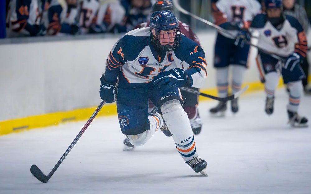 Hershey Trojans forward Blake Umberger drives at IceWorks in the Flyers Cup Quarterfinals by SportsFox Photography, Hershey PA.