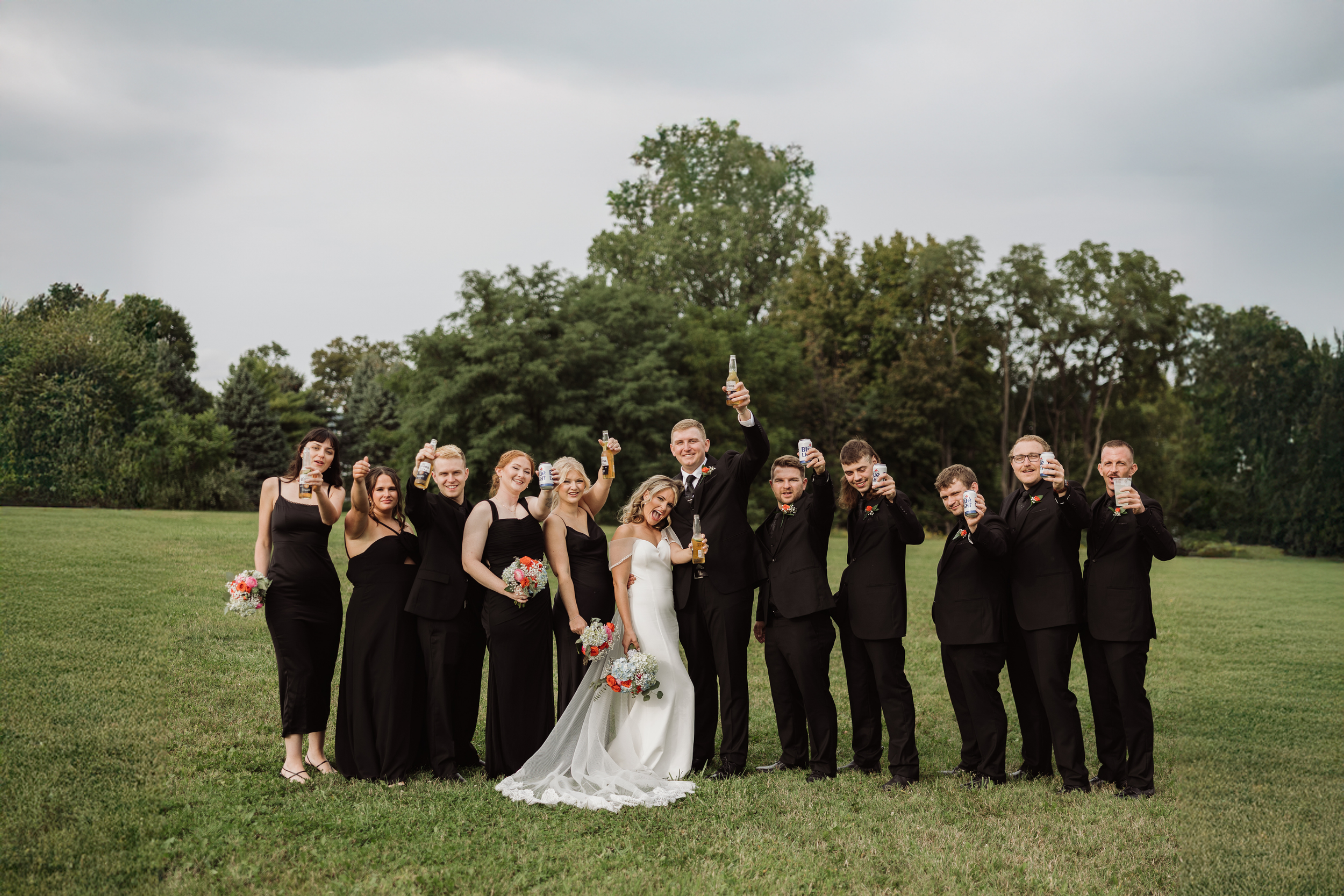 Wedding party portraits with evergreen trees in the Finger Lakes region
