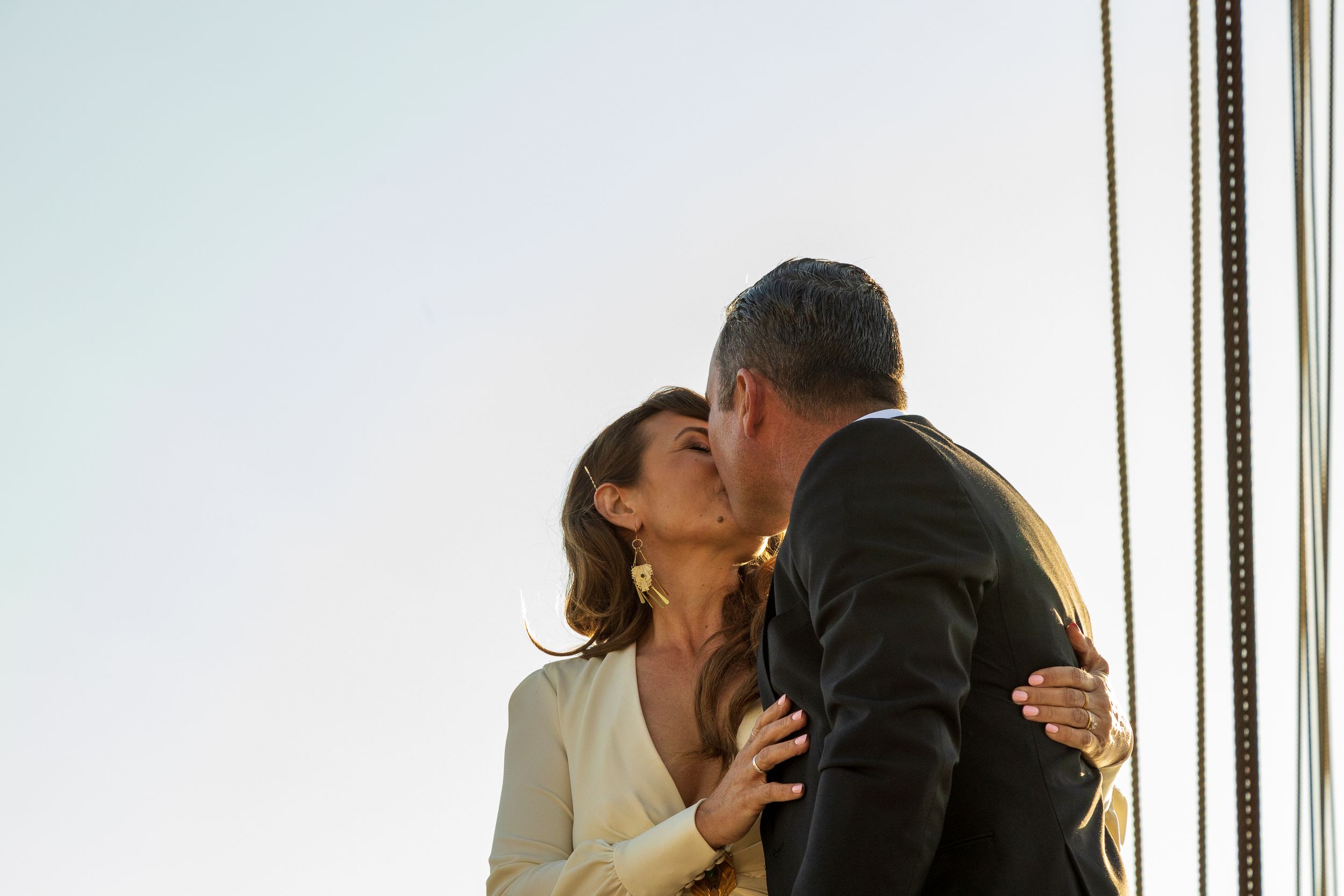 Zeus Holbrook San Diego Wedding Photographer captures kiss on the Tall Ship Californian