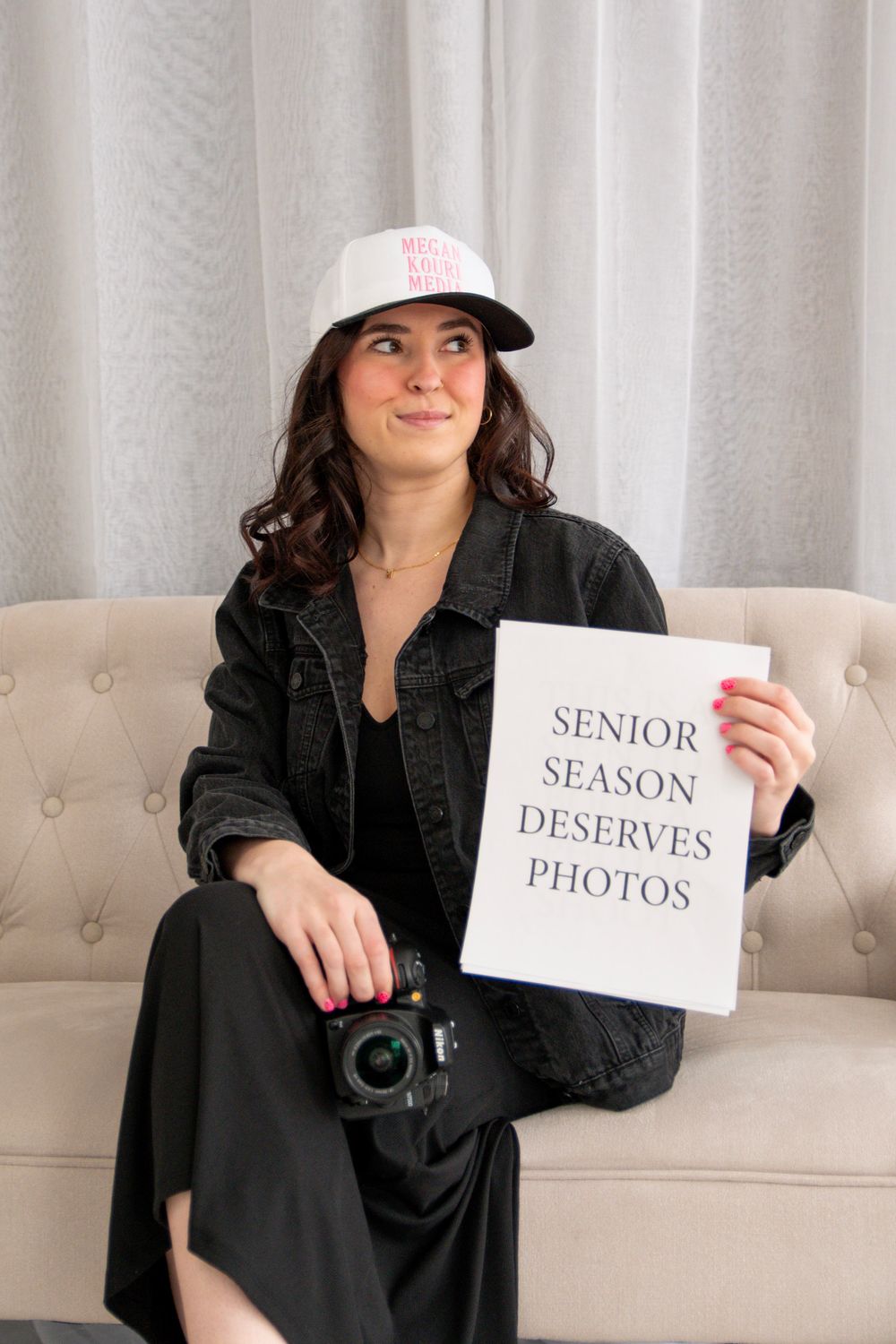 Three images show someone in black attire holding signs for senior photos and season photos against a light background.