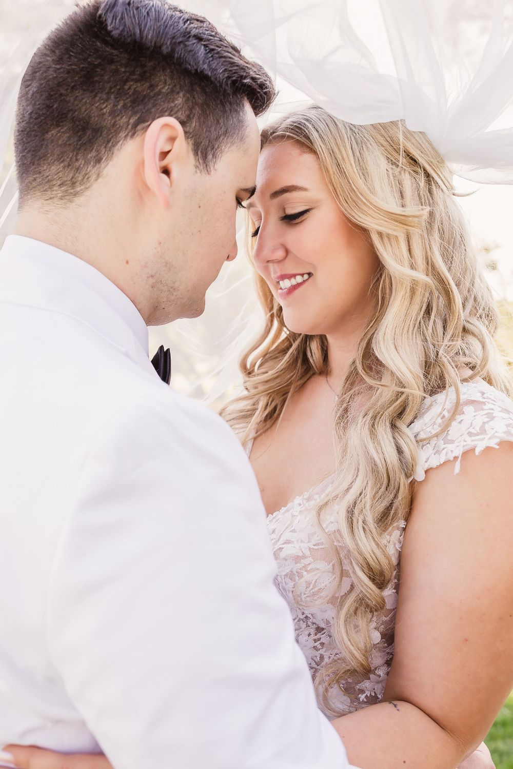 Romantic close-up photo series of newlyweds sharing intimate moments in white wedding attire.