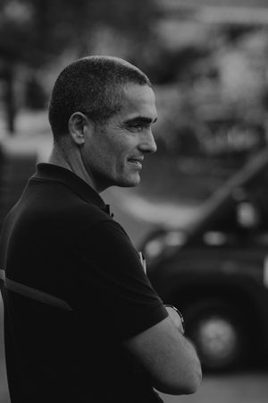 Black and white profile view of someone looking into the distance.