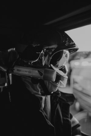Close-up side view of protective gear and equipment in low light conditions.