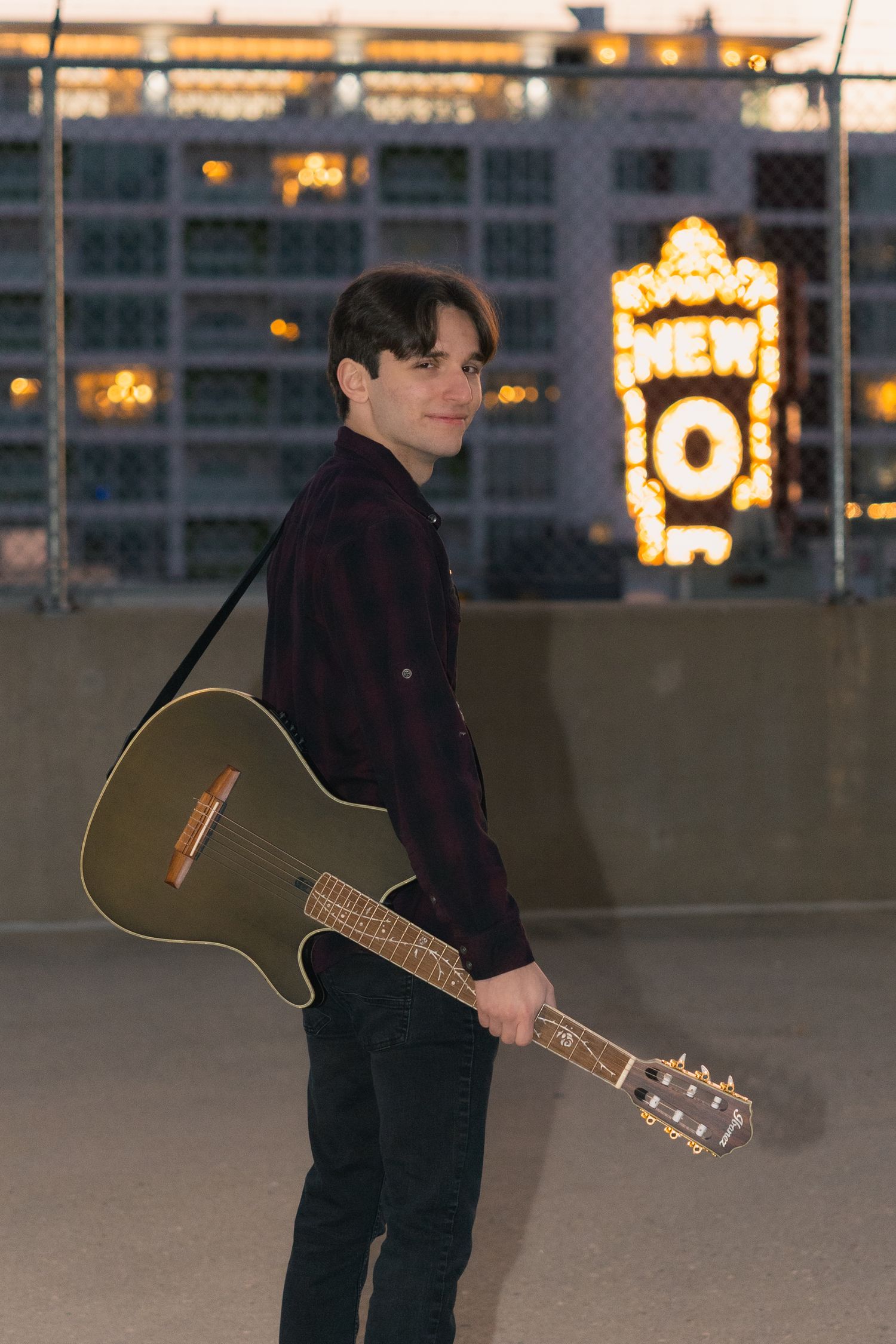 high school senior photos electric guitar urban boy parking garage city lights madison wi state street props musical instrument talent hobby