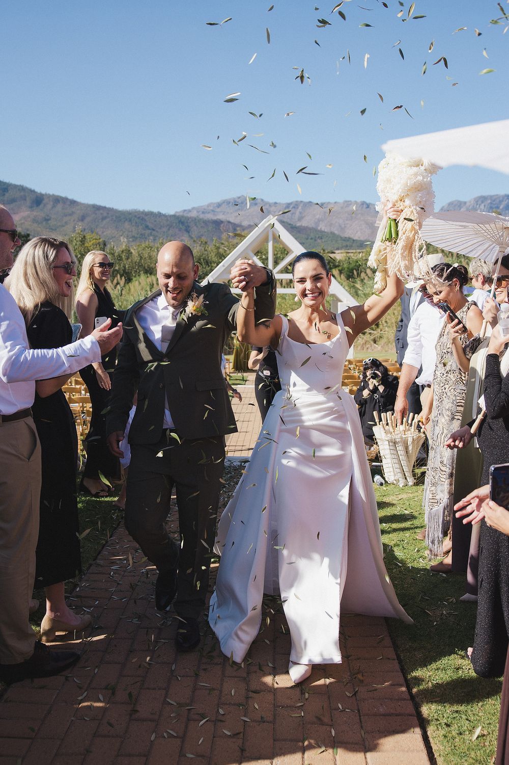 Emotional aisle moment captured during intimate Cape Winelands celebration