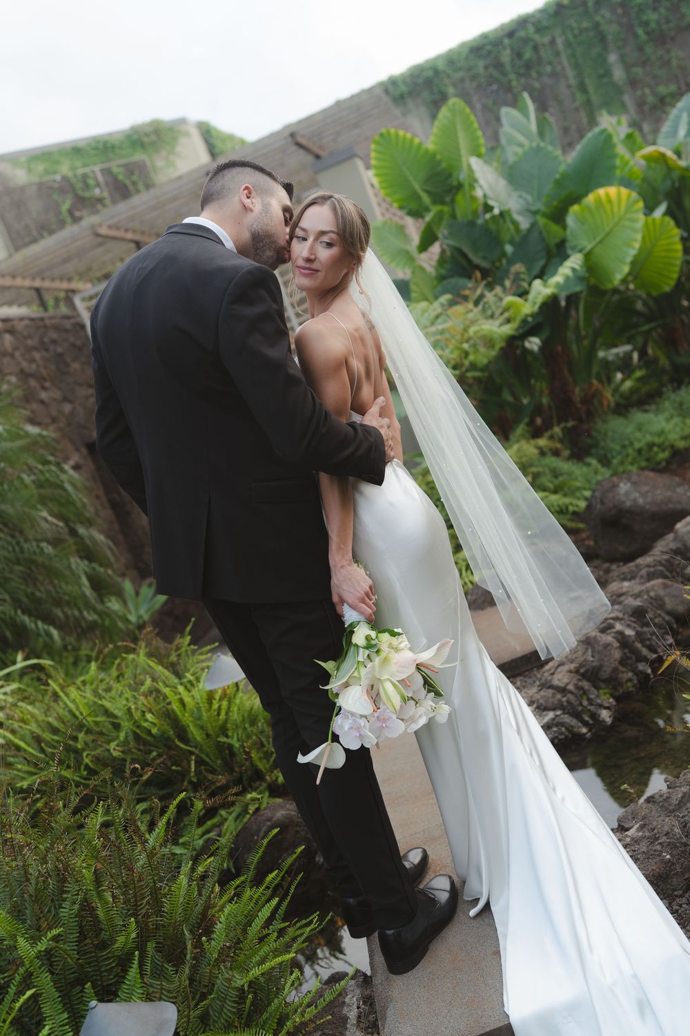 Bride and Groom kissing 1 Hotel Hanalei Bay