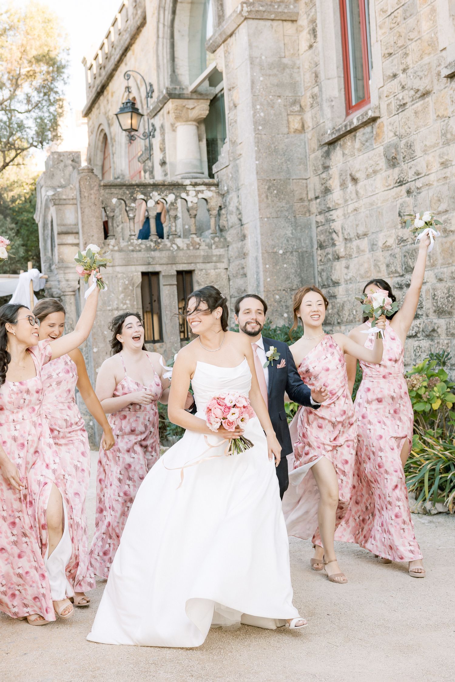 Bridal party dresses in soft tones matching wedding color palette