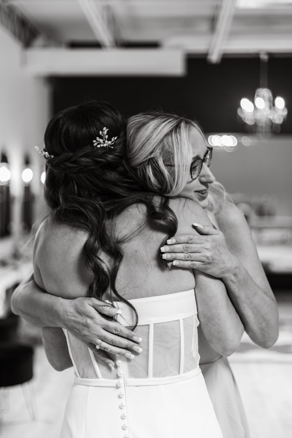 A romantic black and white photo series showing tender moments between a couple on their wedding day.