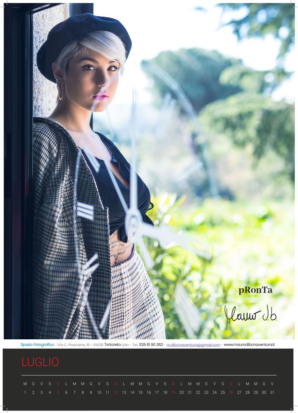 A stylish portrait in a checkered blazer against a soft-focus window with natural light creating a dreamy atmosphere.