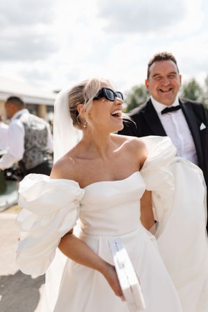 A sunny outdoor wedding celebration filled with laughter and joy.