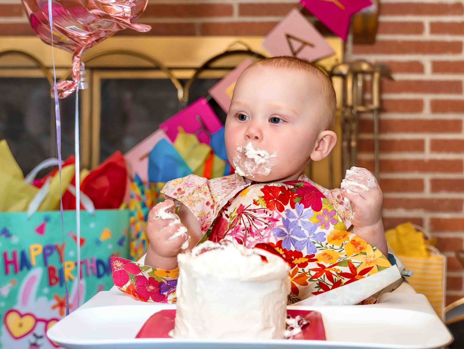 Children birthday party photographer celebrating a boy's 5th birthday with balloons, cake, and friends and family. in Prosper Texas