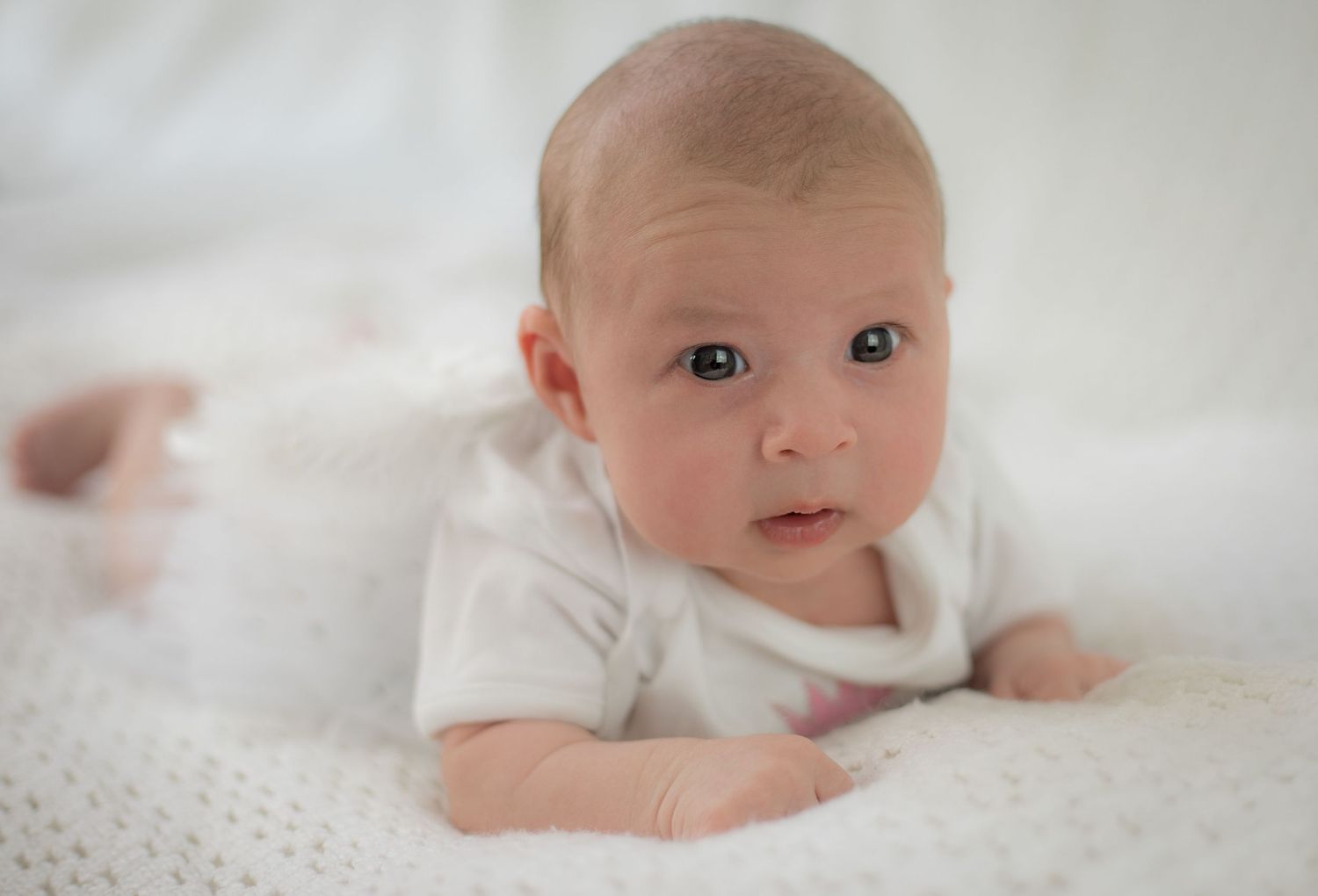 Newborn wearing tutu. Soft, white, beautiful image.