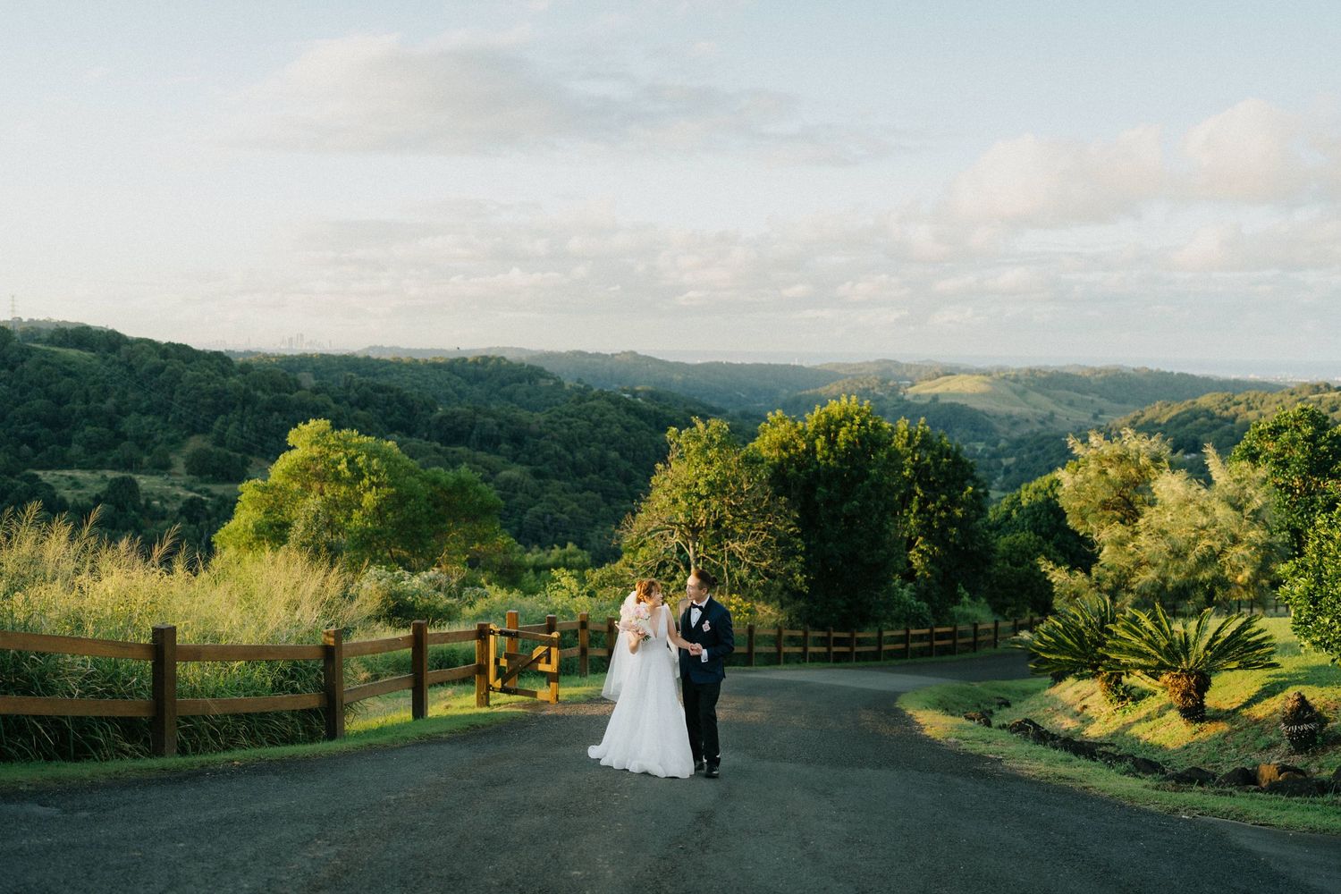 “Romantic couple portraits with stunning hinterland views at Summergrove Estate, captured by a Brisbane photographer.”