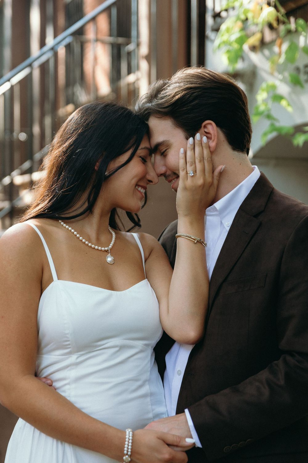 A series of romantic wedding photos showing tender moments between a bride in white and groom in black suit.