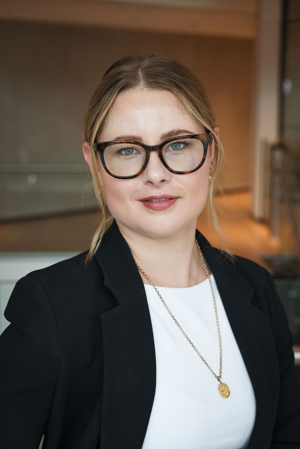 Nicole Hills in an engaging headshot/portrait taken at Suncorp HQ, Auckland by photographer, actress,  artist Amanda Billing.