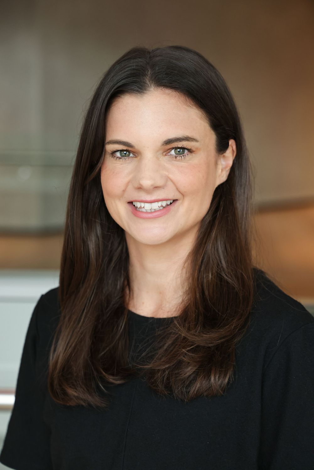 Olivia Barclay in an engaging headshot/portrait taken at Suncorp HQ, Auckland by photographer, actress,  artist Amanda Billing.