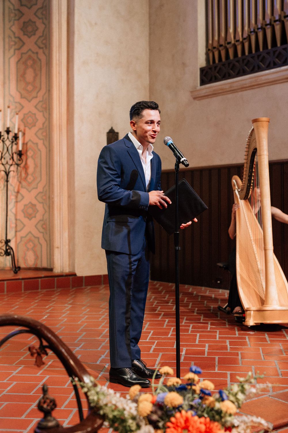 A Santa Barbara officiant speaks to guests before the bride enters the Unitarian Society of Santa Barbara.