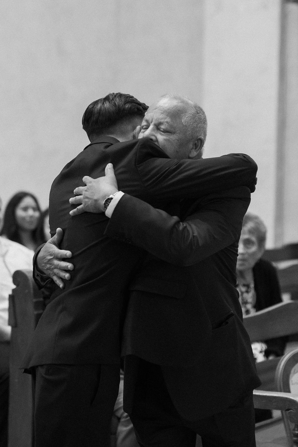 An emotional hug in a black and white image in the Santa Barbara Unitarian Society.