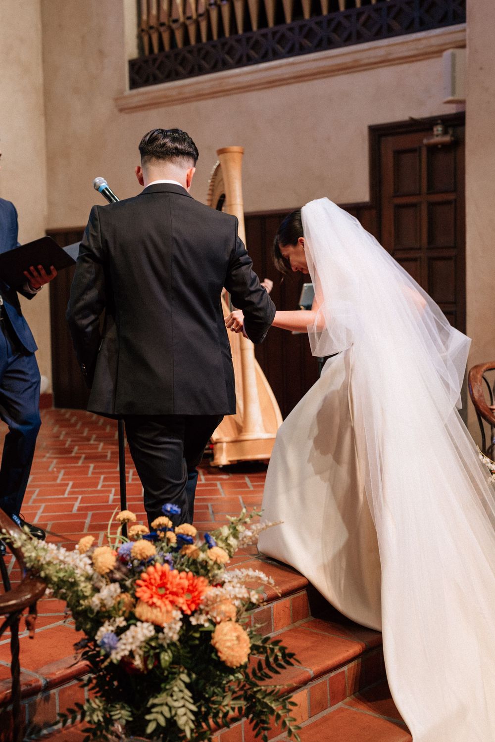 Digital photo of the newly married couple walking back down the aisle after wedding ceremony.