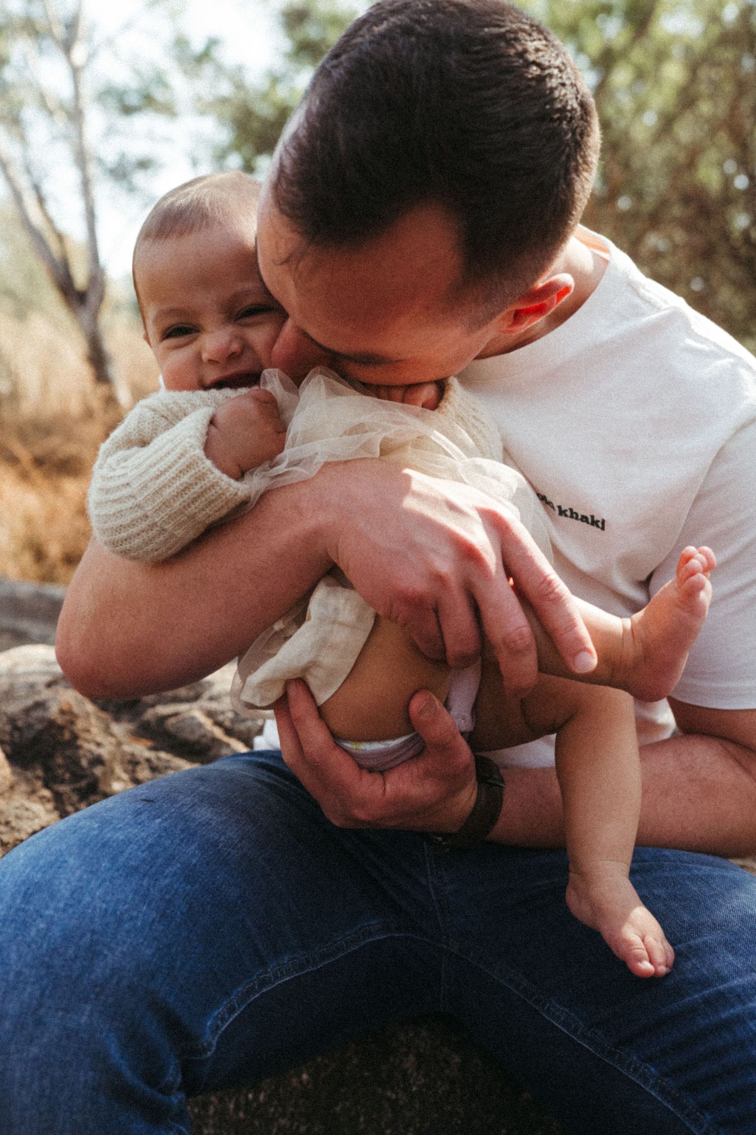 Candid outdoor photography sequence capturing playful family interactions in natural light.