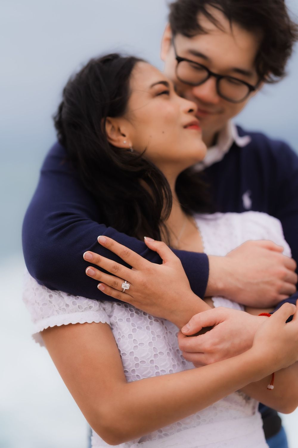 A romantic sequence of intimate embraces and tender moments between a couple wearing navy and white.